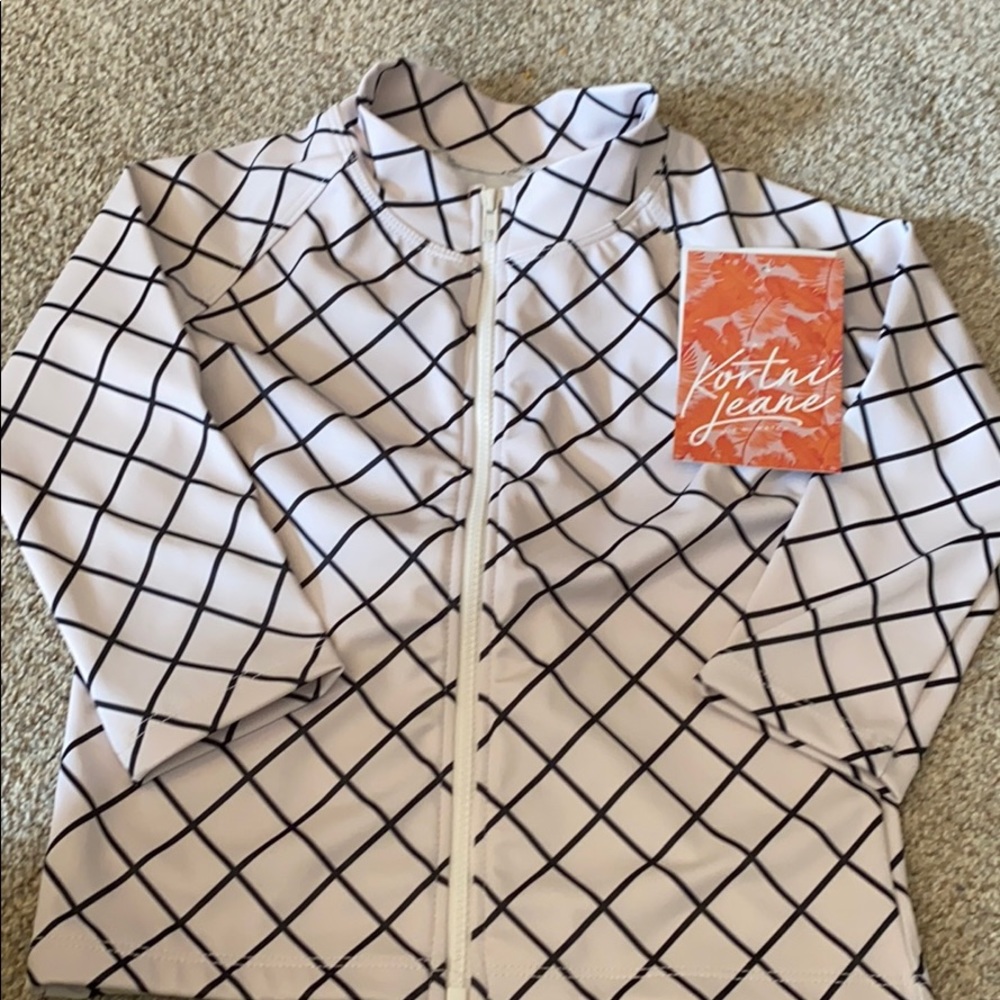 Kortni Jeane 2/3 zip up rash guard.  Brand new